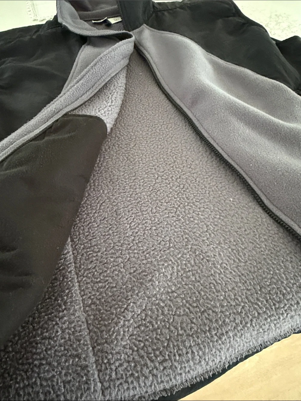 The North Face Black Shell with Gray Fleece-Lined Men's Vest